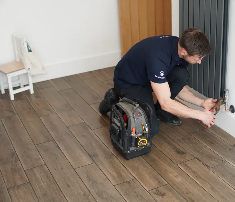 Our plumber working on a radiator