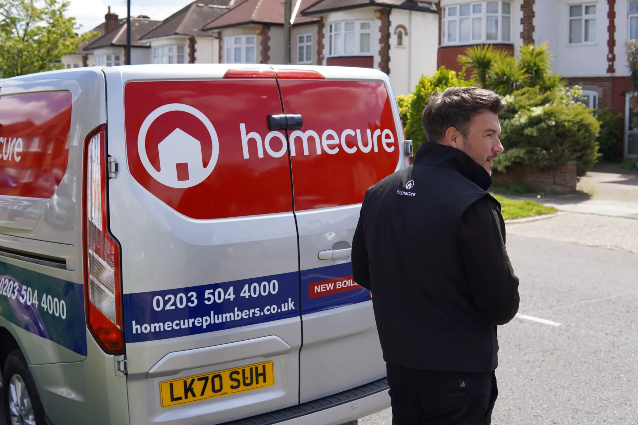 London boiler service engineer standing outside the van.