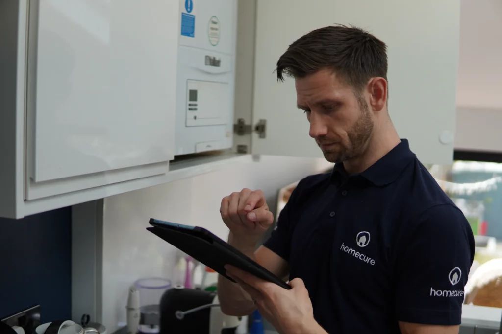 Homecure heating engineer in Brixton servicing a boiler